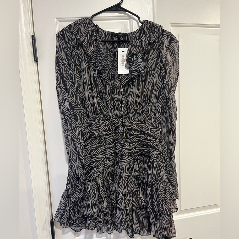 Never worn boutique dress. BRAND NEW WITH TAGS.